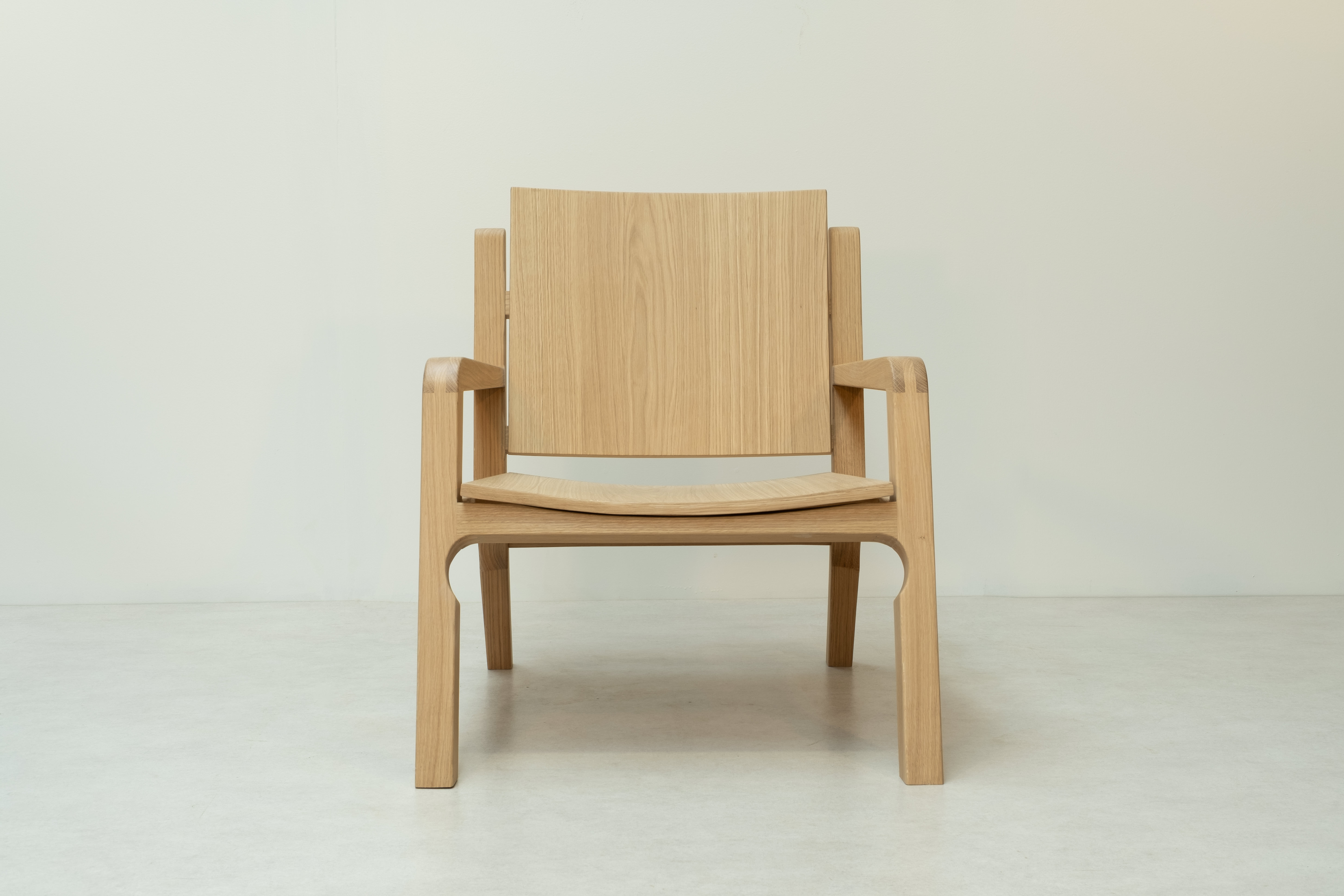 The Dione — oak lounge chair